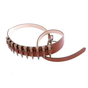 Detail of faux leather cowboy holster belt with bullet decorations and vintage buckle