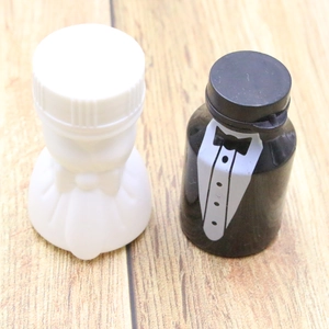 Detail of bride and groom heart bubble wand bottles for wedding and party favors