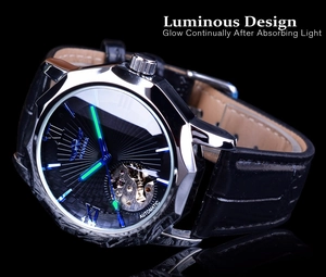 Macro detail of the luminous green hands and skeleton movement on a men's automatic watch