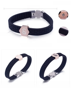 Detail of soft silicone bracelet with 18K gold plated clasp and magnetic therapy stones