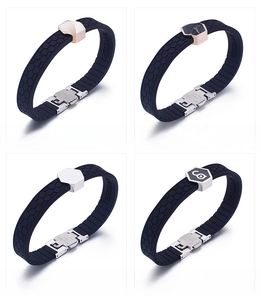 Detail view of four silicone sports bracelets with honeycomb texture and metal clasps