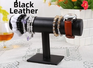 Detail view of T-bar jewelry display stand with bracelets and watch in black leather finish