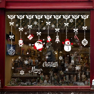 White Christmas window decals featuring Santa Claus and snowman festive holiday decorations