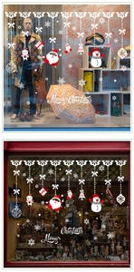 Detailed Christmas window decals showing Santa, snowmen, and festive snowflake patterns