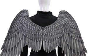 Macro detail of realistic grey feather texture on oversized Mardi Gras angel wings costume