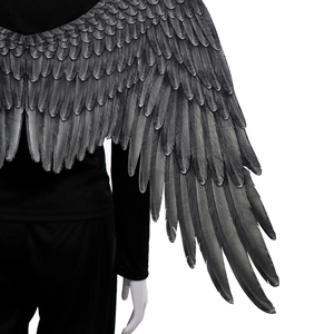 Detail of large black costume wings with realistic printed feather texture for cosplay