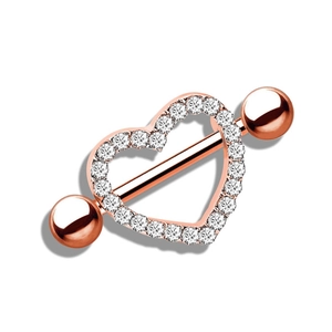 Macro shot of heart-shaped nipple ring in rose gold with sparkling zircon stones