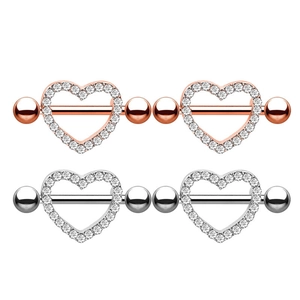 Detail of heart-shaped zircon nipple rings in rose gold and silver surgical steel