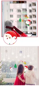 Detailed Christmas window decals featuring Santa, reindeer, and snowflakes on glass