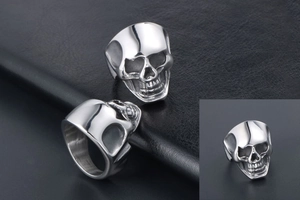 Detailed macro shot of a silver skull ring with gothic punk metal texture and craftsmanship