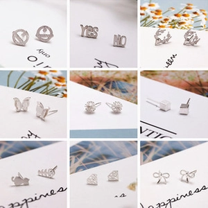 Detailed grid of silver 925 stud earrings in butterfly and geometric shapes for women