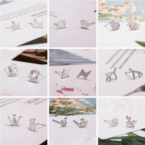 Collection of 925 sterling silver stud earrings featuring heart, swan, and crane designs