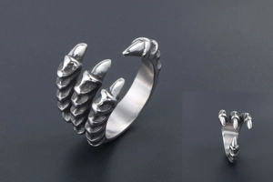 Detail view of vintage dragon claw ring featuring scales and retro silver punk texture