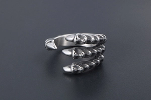 Macro detail of gothic dragon claw ring featuring retro silver oxidized stainless steel