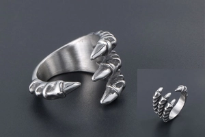 Detailed close-up of retro dragon claw steel ring featuring antique finish and scales