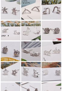 Collection of various silver stud earrings in animal, plant and geometric shapes
