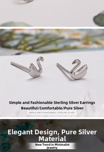 Detailed view of S925 sterling silver swan stud earrings with mirror polished finish