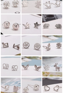 Macro display of diverse silver sterling ear studs including stars and animals shapes