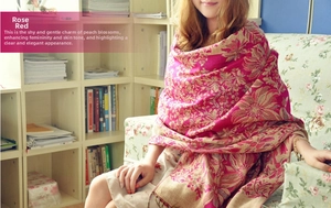 Close-up of bohemian floral jacquard weave on rose red winter shawl wrap for women