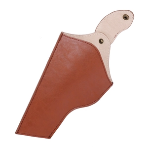 Detailed view of a brown leather cowboy holster with gold buckle on a white background