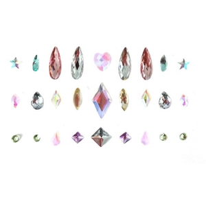 Macro view of crystal rhinestones in various shapes and colors for body art