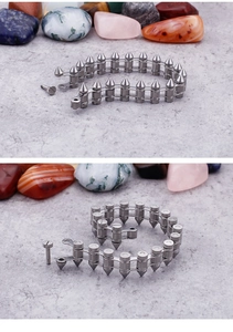Detailed view of silver punk spiked chain bracelet with screw locking mechanism