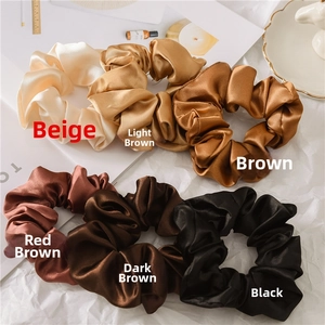 Set of 6 satin silk scrunchies in earth tones displayed on a white aesthetic background