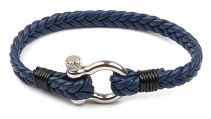 Detail of blue braided leather bracelet featuring a silver metal horseshoe clasp with screw