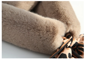 Close-up of soft khaki faux rabbit fur scarf featuring a chic leopard print satin ribbon