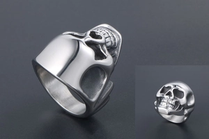 Close-up of gothic stainless steel skull ring with high polished silver finish