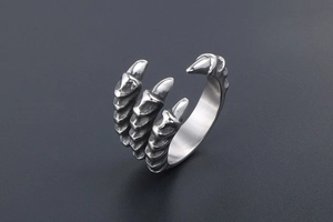 Detail of vintage silver dragon claw ring showing sharp texture and adjustable band