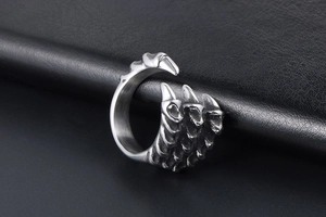 Macro view of vintage dragon claw ring with detailed stainless steel texture on leather