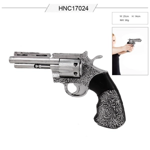 Detail of silver cowboy revolver prop with floral carvings for Halloween cosplay costumes