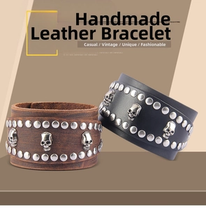Detail of genuine leather bracelet with metal skull motifs and punk style rivets