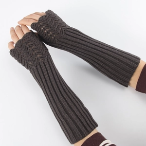 Detail view of dark brown knit fingerless long gloves featuring fish scale stitch pattern