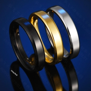 Detailed view of 4mm polished titanium steel rings in silver, gold, and black colors