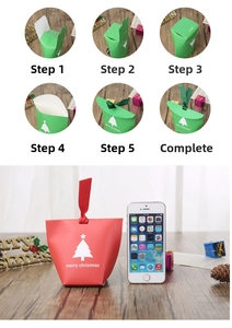 Size comparison of Christmas gift bags with a smartphone on a wooden surface