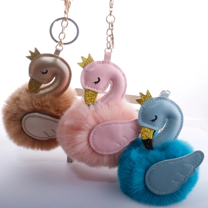 Swan faux fur pompom keychain with gold crown and PU leather wings in three pastel colors