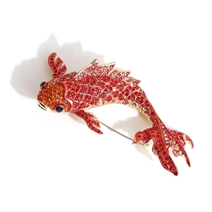 Exquisite koi fish brooch with red and orange rhinestones on a gold-plated base