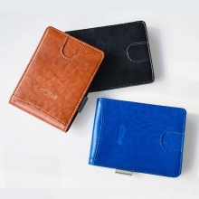 Three men's slim leather card holders in brown, black, and blue with external card slots