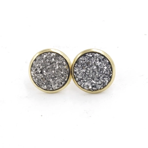 Detailed macro view of 12mm round gold plated stainless steel studs with grey druzy resin