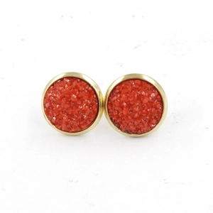 Detailed macro view of 12mm red druzy stud earrings with golden stainless steel plating