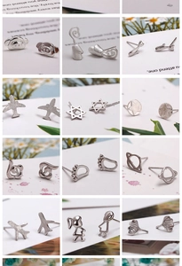 Detail shots of various silver stud earrings featuring monkey, plane and star shapes