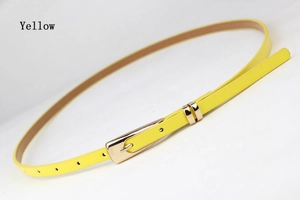 Slim yellow women belt with golden metal pin buckle and polished ring details