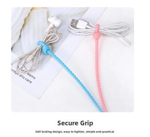 Close-up of pink and blue silicone cable ties bundling USB and earphone cords.