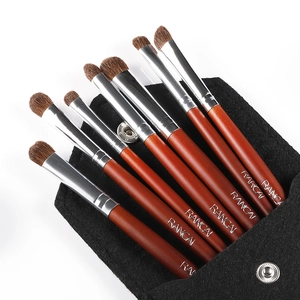 7-piece natural pony hair eye makeup brush set with reddish-brown handles and felt pouch