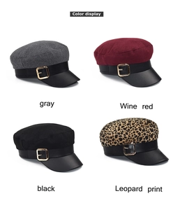Detail display of four wool berets in gray wine red black and leopard print with gold buckles
