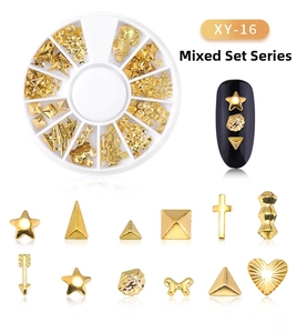 Macro view of gold metal moon and star nail art studs in mixed series wheel box