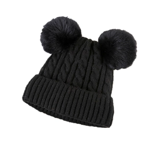 Classic black knitted beanie hat with two fluffy pom-poms for winter warmth and style