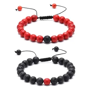 Detail of adjustable braided lava and turquoise stone bracelets with hand-woven wax cords